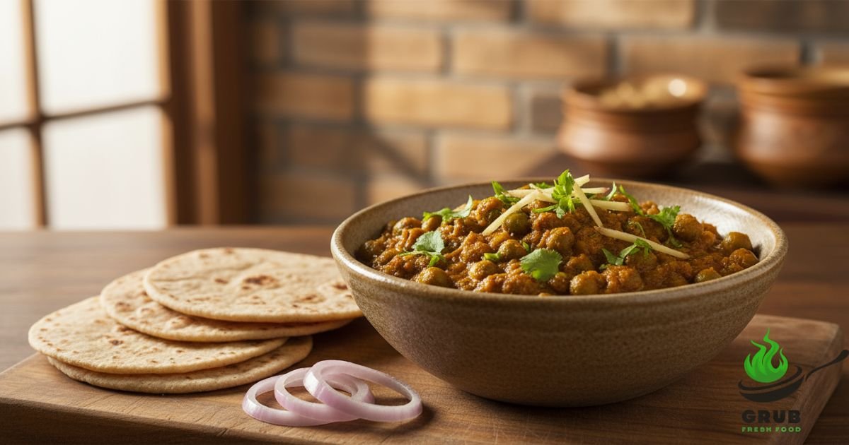 Dry peas curry served with chapati and onions on rustic table.