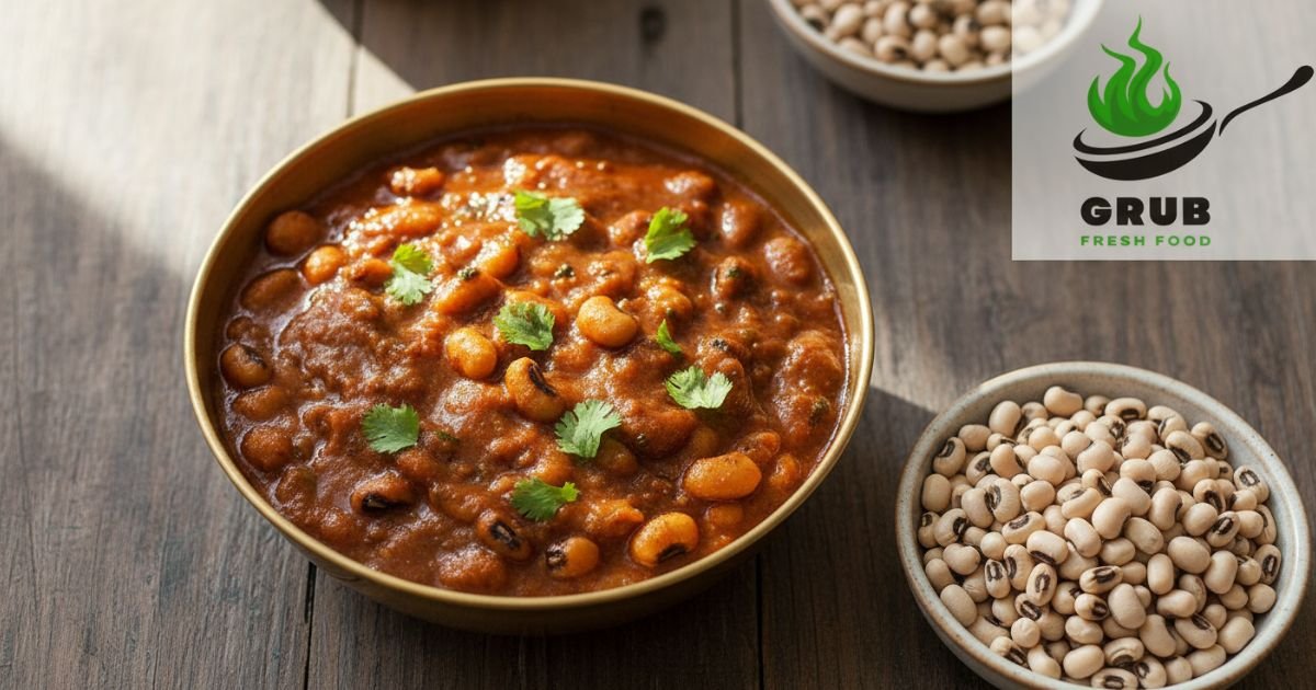 Cooked chowli curry with coriander garnish and raw black-eyed peas on the side.